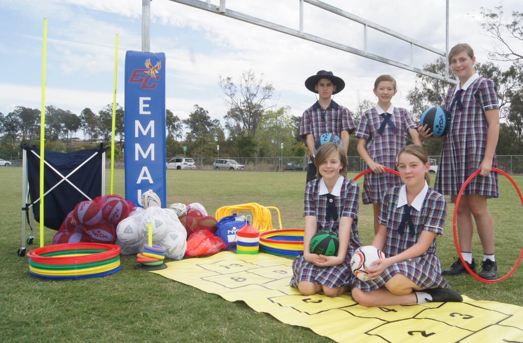 SPORTS GEAR: Year six Emmaus College students Luke O'Toole, Kirra Grime, Emily Johnson, Annabelle Gunther and Summer Wells with the sporting equipment provided through Coles' Sports for Schools program. Photo: Jacob Wilson