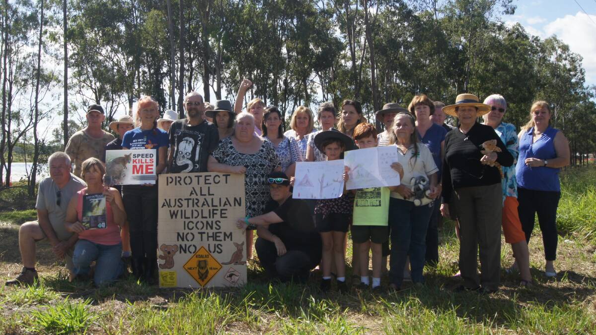 UNHAPPY: More than 25 people attended a protest at the Greenbank dam on Friday. Photo: Jacob Wilson