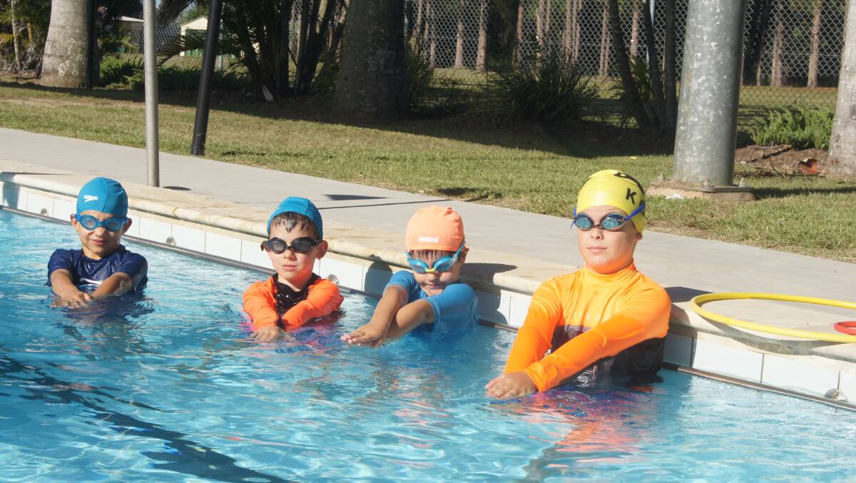 LIFE SKILLS: Sam and Jessie Rose with Tolyson Baker and Aleksandar Hall learn basic swimming skills at Ken Glass Swimming. Photo: Jacob Wilson