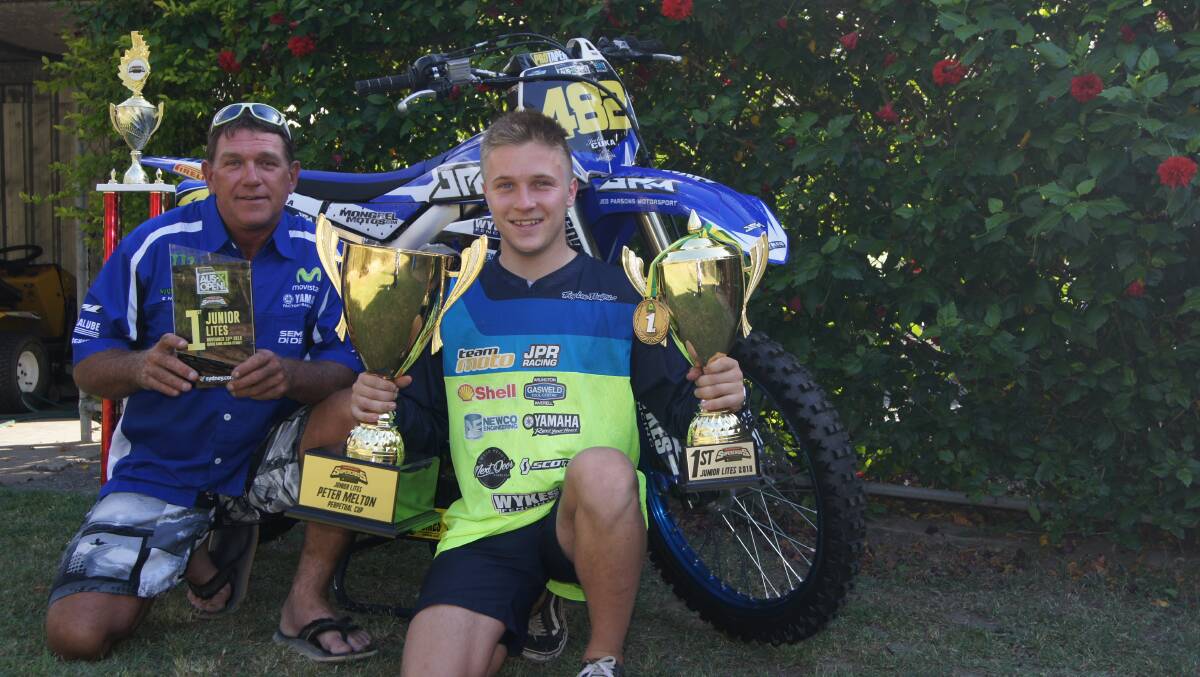 TROPHY: Jimboomba Supercross racer Jake Cuka with local sponsor Dave Wykes Photo: Jacob Wilson