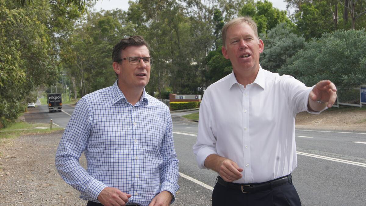FUNDING: Infrastructure Minister Alan Tudge with Forde MP Bert van Manen on the High Road and Jarvis Road intersection at Waterford. Photo: Jacob Wilson