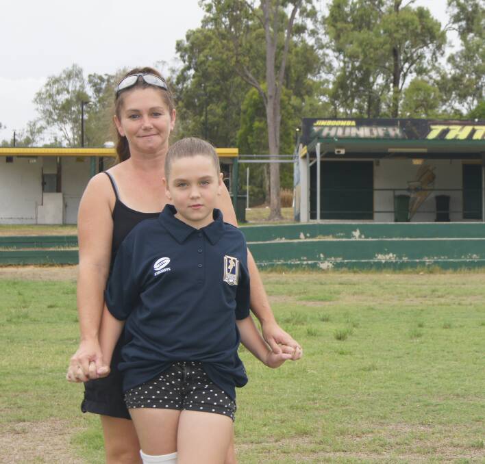 RECOVERY: Cassandra and Charli Berghauser at the Jimboomba Thunder Rugby League Grounds ahead of Charli's surgery with Dr Teo in February this year. Photo: Jacob Wilson