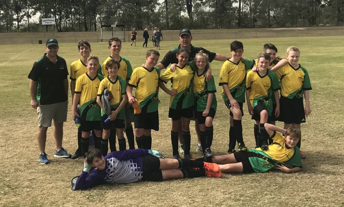 TEAM SPIRIT: The Logan Village under 13 falcons have topped the ladder for the 2018 season.