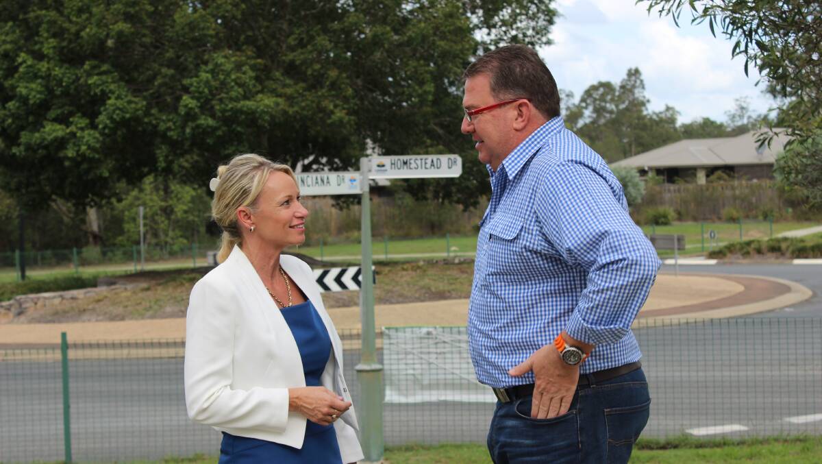 UPGRADES: Cr Trevina Schwarz and Wright MP Scott Buchholz at the Homestead and Poinciana Drive roundabout. 