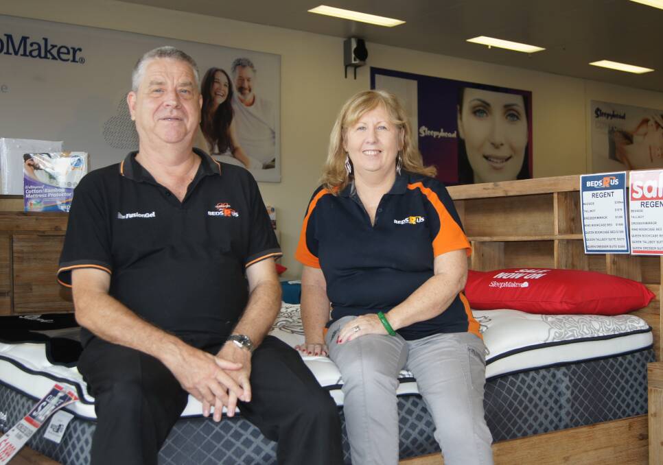 ON THE JOB: Beds R Us Browns Plains store manager Martin Hall and shop assistant Josie de Mor are optimistic about the store's future. Photo: Jacob Wilson