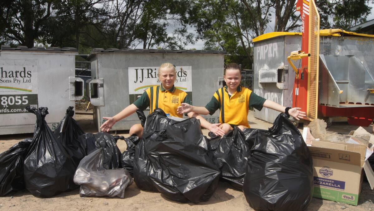 Year 6 students Kiara Lee and Mia Heseltine helped clean the school grounds.