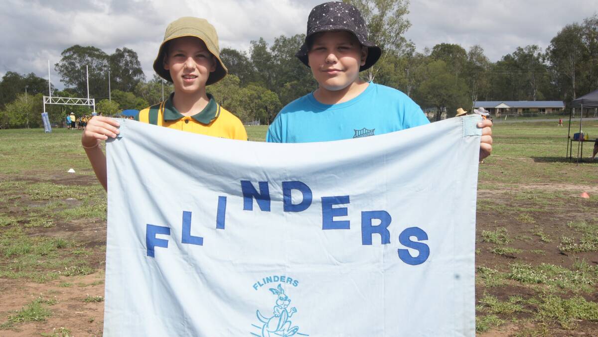 WINNERS: Flinders House supporters Kruze Ward and Rilee Hetherington showed good sportsmanship on Monday. Photo: Jacob Wilson