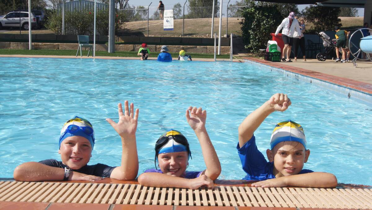 LEARN TO SWIM: Jimboomba Stingrays swimmers Connor Checuti, Samarah McDougall and Damien Shaw. Photo: Jacob Wilson