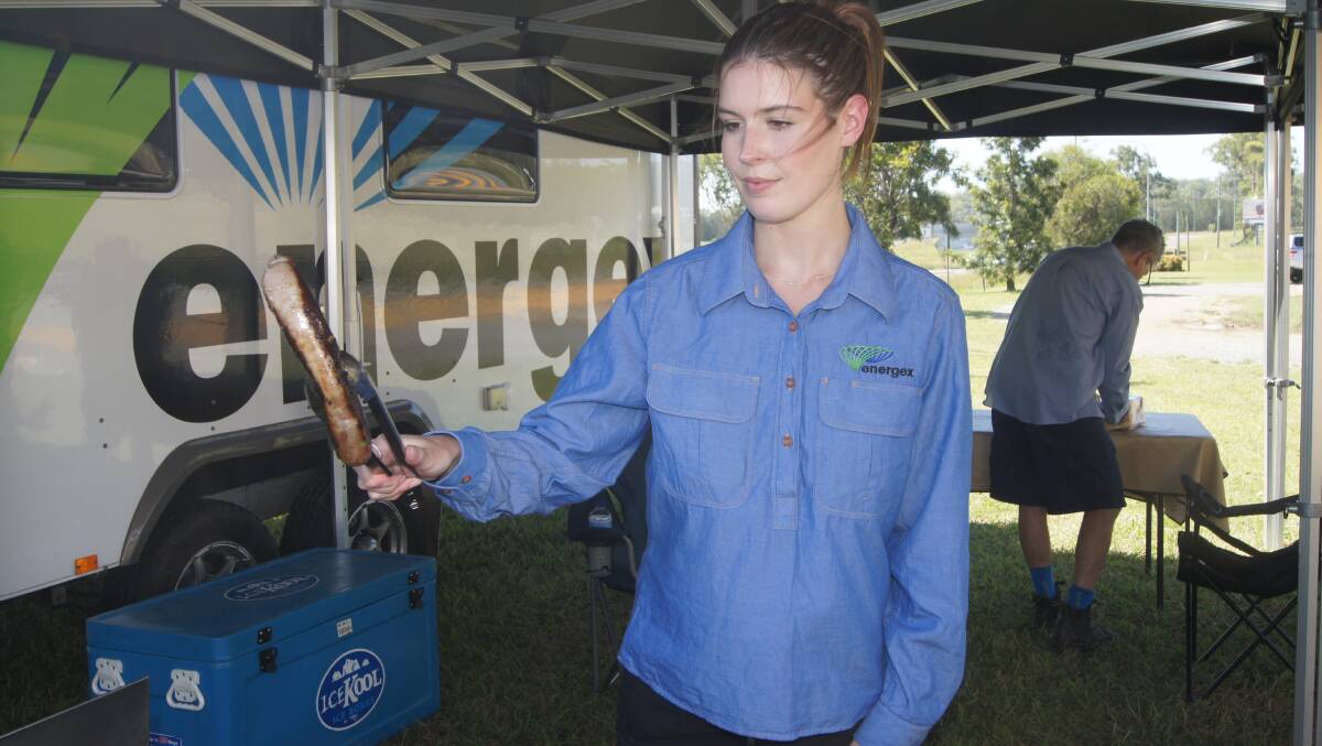 READY TO HELP: Holly Lister is among a group of Energex workers who have set up a base at Jimboomba today. Photo: Jacob Wilson