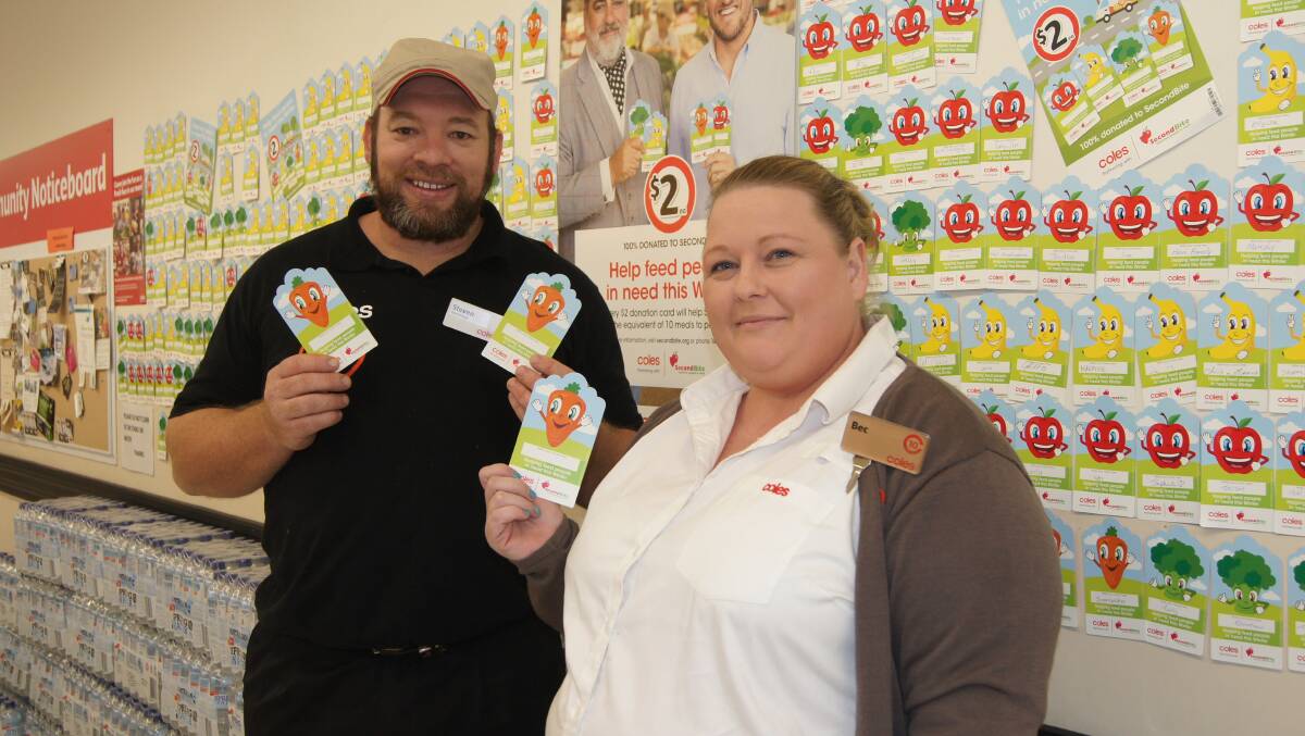 CHARITABLE: Coles Jimboomba store manager Steven Cooper and service manager Bec Bean. Photo: Jacob Wilson