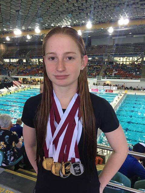 CHAMPION: Greenbank teen Mollie O'Callaghan won seven medals at the Queensland Short Course Championships at the Chandler Aquatic Centre.