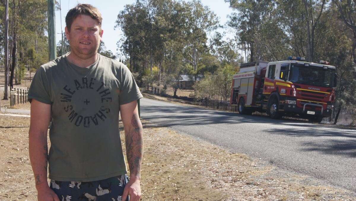 QUICK EFFORT: Tyson Major helped his Jimboomba neighbours while their property was at risk from a grass fire. Photo: Jacob Wilson 