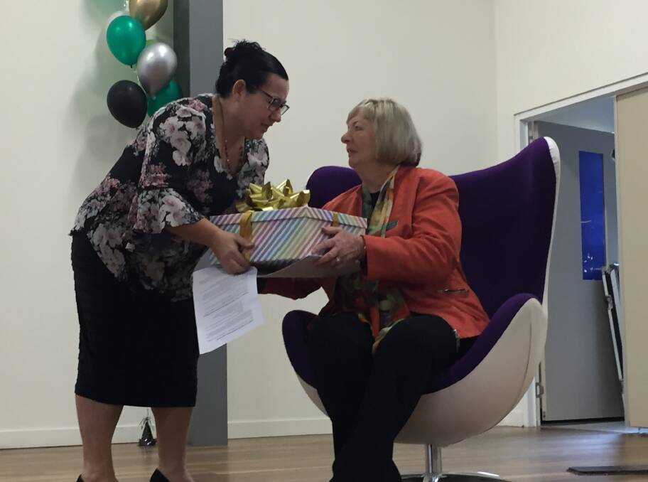 FAREWELL: Greenbank State School P&C member Sharon Aldridge presented Ms Quinn with a gift for her last day.