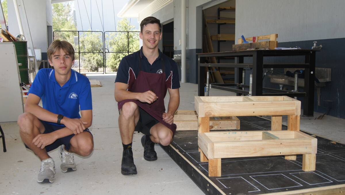 STAIRCASE: Year nine Emmaus College student Bailey Cook with woodwork teacher Andrew Titmarsh. Photo: Jacob Wilson