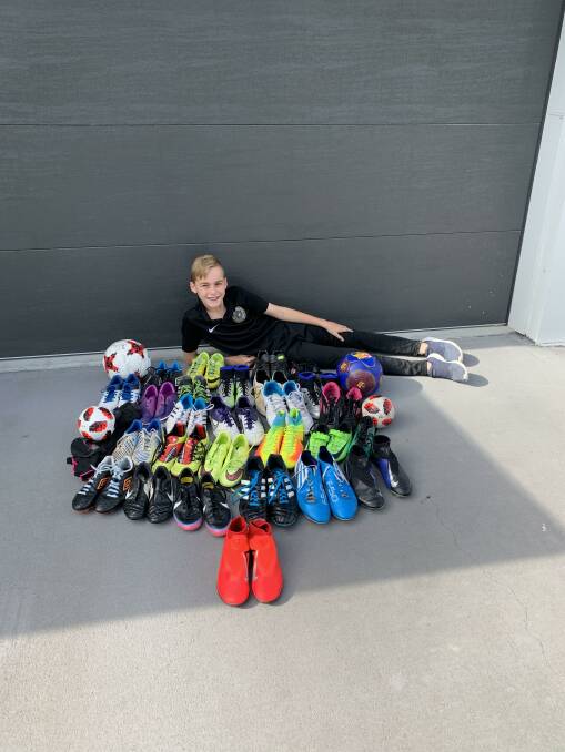 CAMPAIGN: Jimboomba soccer player Elijah Barwick aims to collect 150 pairs of soccer shoes to donate for kids in Ghana.
