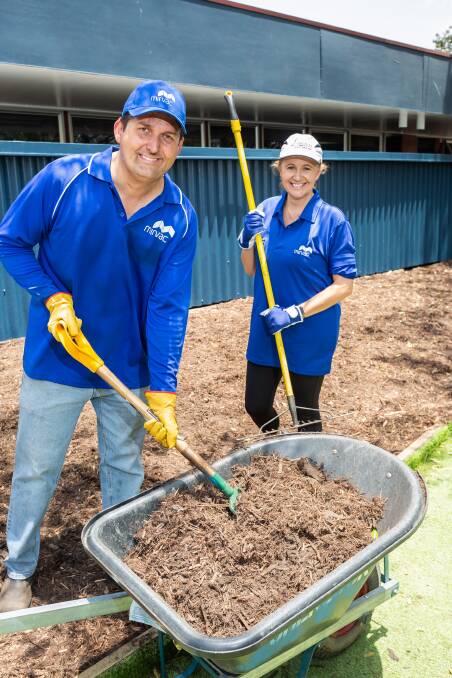 FRESH LOOK: Mirvac volunteer Mark Clancy and Suzanne Guastini from Enriching Communities Greenbank spent time to rejuvenate Greenbank State School.