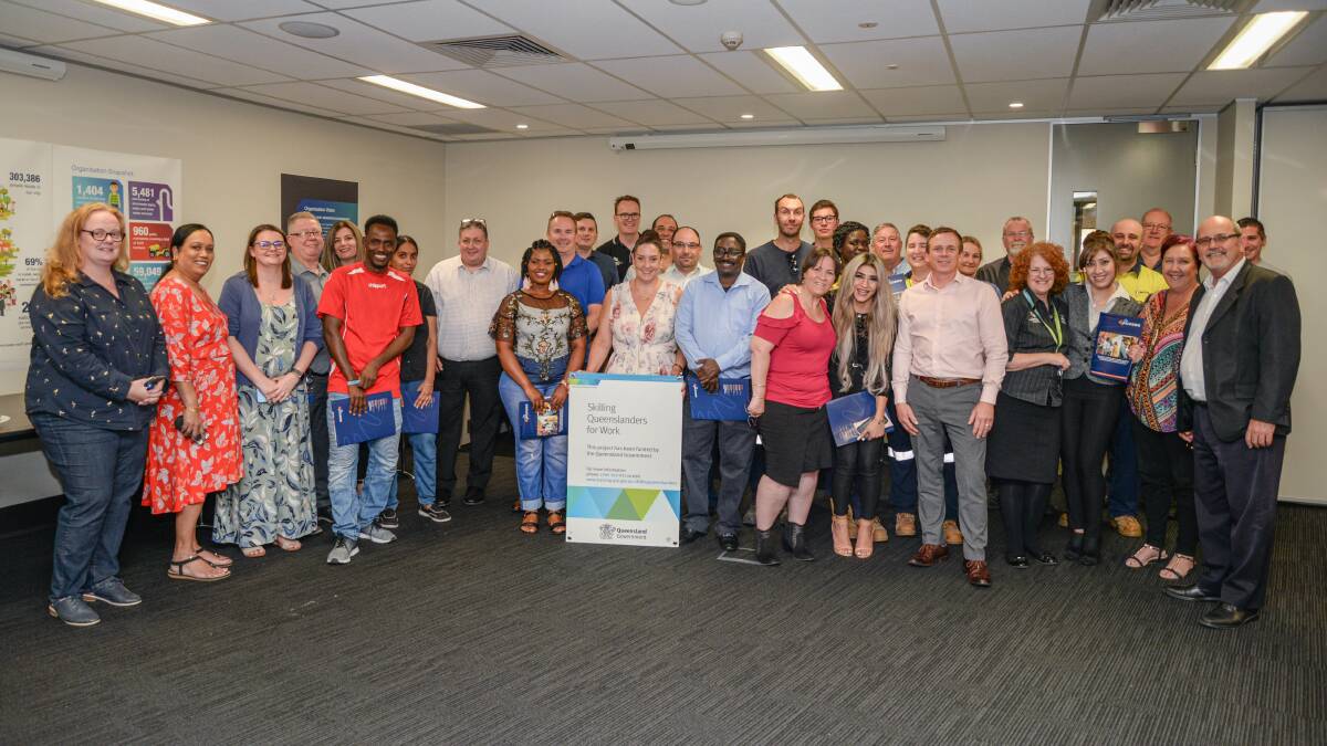 GRADUATION: Logan City Council staff and trainee refugees celebrate the completion of an 18-week program. 