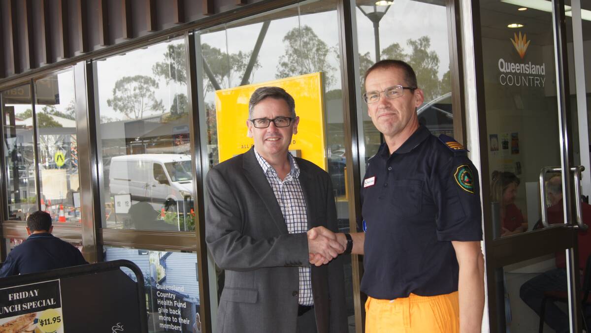 PARTNERSHIP: Queensland Country Credit Union acting CEO Andrew McArdle and Rural Fire Services inspector Mark Doble at the Jimboomba branch. Photo: Jacob Wilson