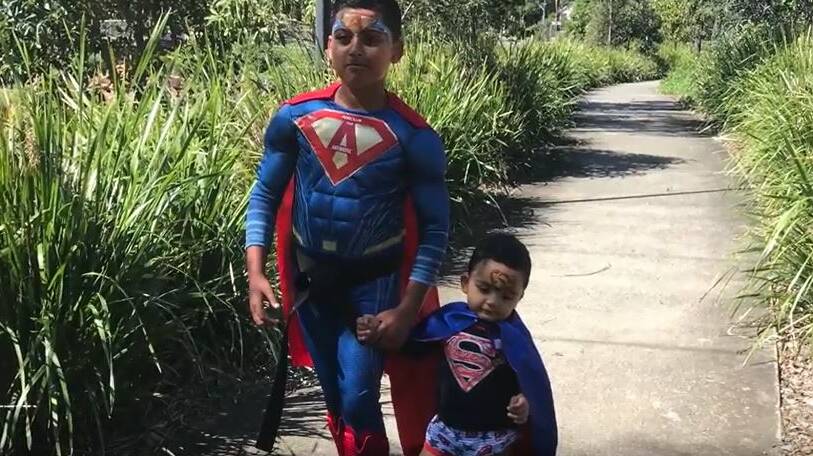 Ashutosh Vaitha dressed up as superman with his brother as part of his video project.