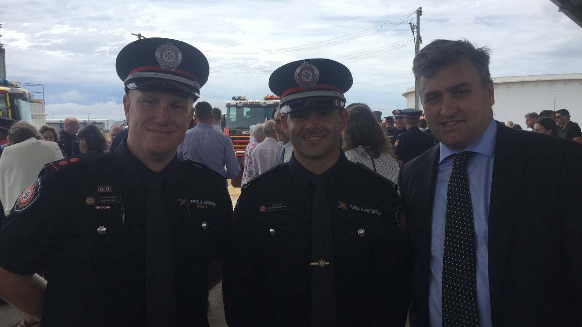 GRADUATE: Jimboomba Fire Station acting captain Jason Hall with recruit Jacob Lamberton and Logan MP Linus Power.