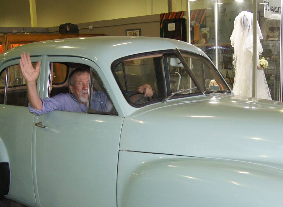 MOTORING ON:  Volunteer Graham Filkins shows of the 1953 FX Holden at the Kingston Butter Factory's Historical Museum. Photo: Jacob Wilson
