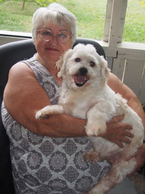 BEST FRIENDS: Crestmead resident Sandra Silver with her new three-year-old shih tzu Dodger. Photo: Logan Council