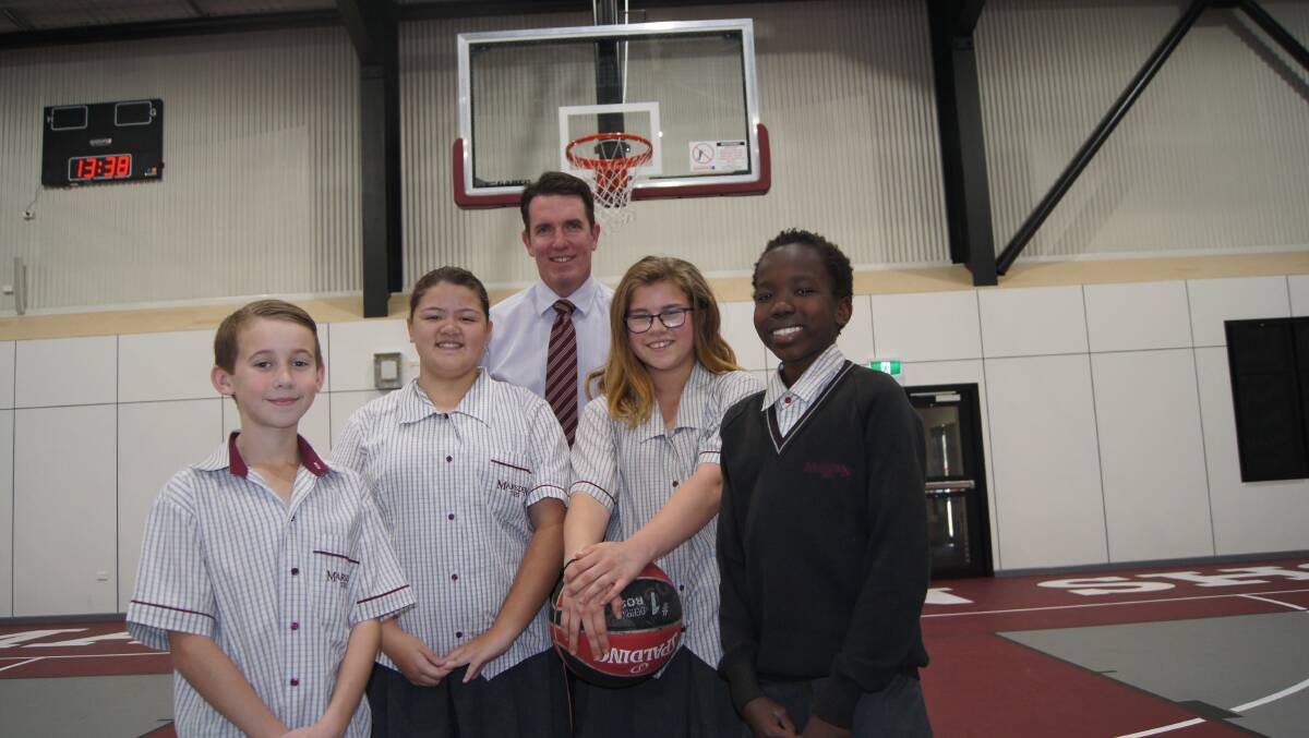 MILESTONE: Grade 7 Marsden State High School students Jenson Crotty, Sophie Corbett, Jasmine Lee and Stephen Silver with principal Andrew Peach at the Centre of Excellence. Photo: Jacob Wilson