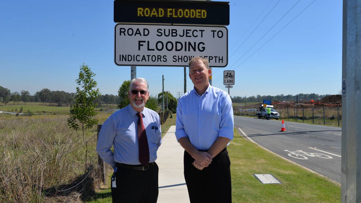 PARTNERSHIP: Logan City Council's acting director of Roads and Water Daryl Ross with Forde MP Bert van Manen at Logan Reserve Road. 