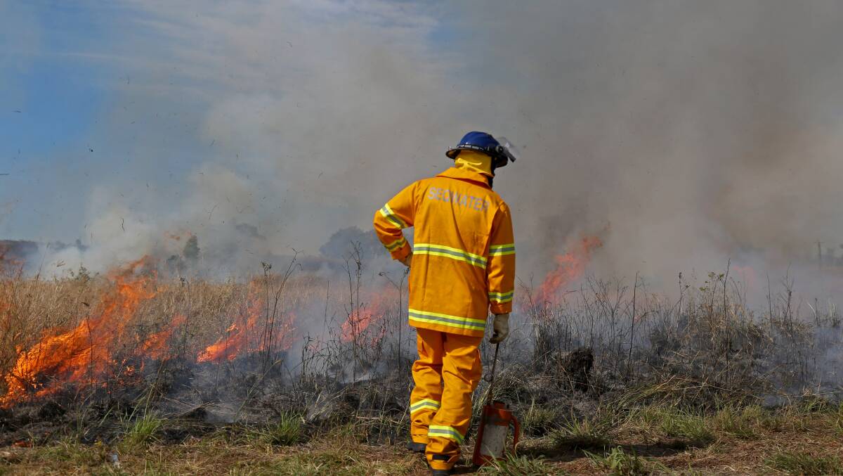 UNDER CONTROL: Seqwater ranger Scott Daniells conducting a controlled burn during the fire season. Photo: Seqwater