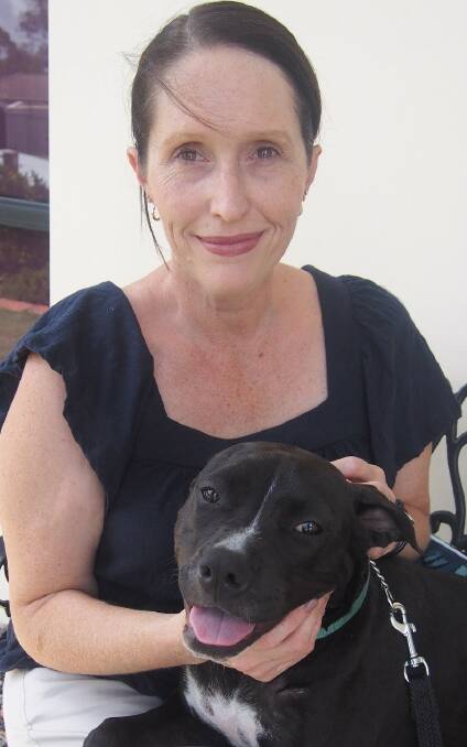 LOVABLE: Jimboomba resident Kirsty Geppert-Squires with new American staffy Lottie.