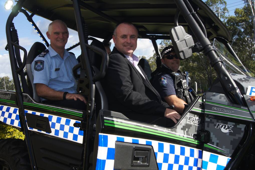 ATV: Jimboomba Police Senior Sergeant Peter Waugh with Logan City Council's Community Services Manager Nick McGuire and constable Michael Eiser. Photo: Jacob Wilson