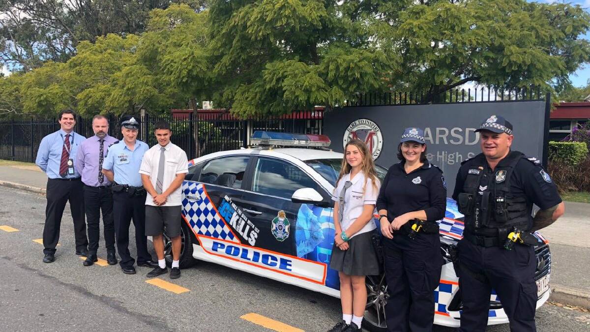 DRUG CRACKDOWN: Marsden State High School captains Josh Downes and Porsha Sipos with Logan police officers who unveiled anti-ice campaign material on a patrol car. Photo: Queensland Police Service 