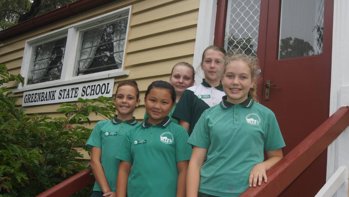 MILESTONE: Year 6 Greenbank State School student councillors Caroline Knight, Jailyn Xiong, Kayla Miller, Ella Harbouln and Eliza Poole outside the Greenbank Old school building which will be transformed as part of the school's 125 year anniversary. Photo: Jacob Wilson