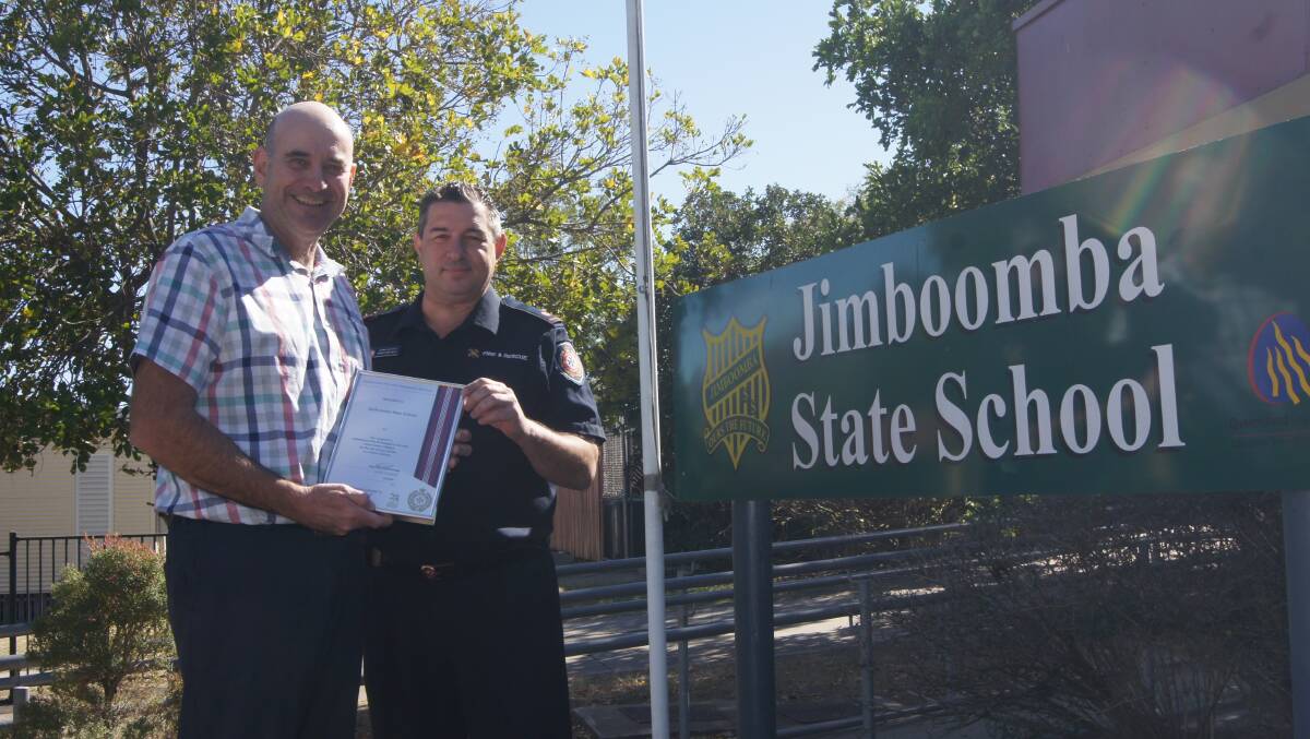 PARTNERSHIP: Jimboomba State School principal Tim Farrell with Jimboomba Fire Station acting lieutenant Ross Cristaldi. Photo: Jacob Wilson 