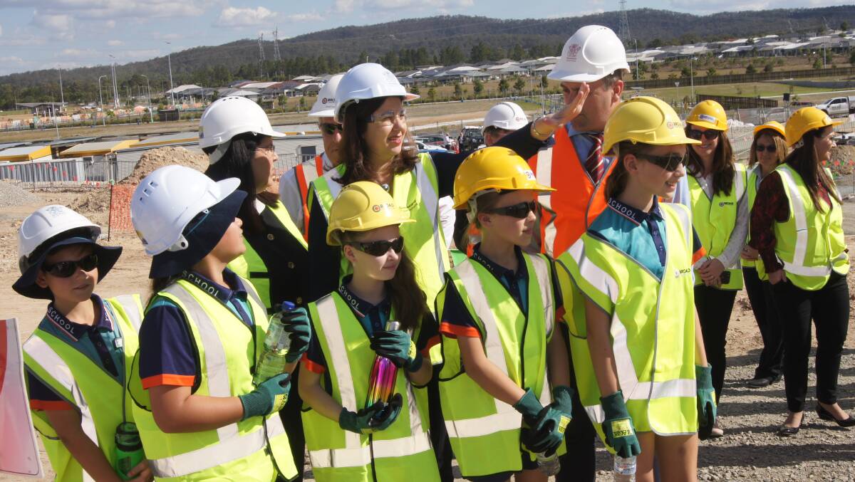 CONSTRUCTION: Five future Yarrabilba State Secondary College students toured the construction site with Queensland Premier Annastacia Palaszczuk, Education Minister Grace Grace and Logan MP Linus Power. Photo: Jacob Wilson