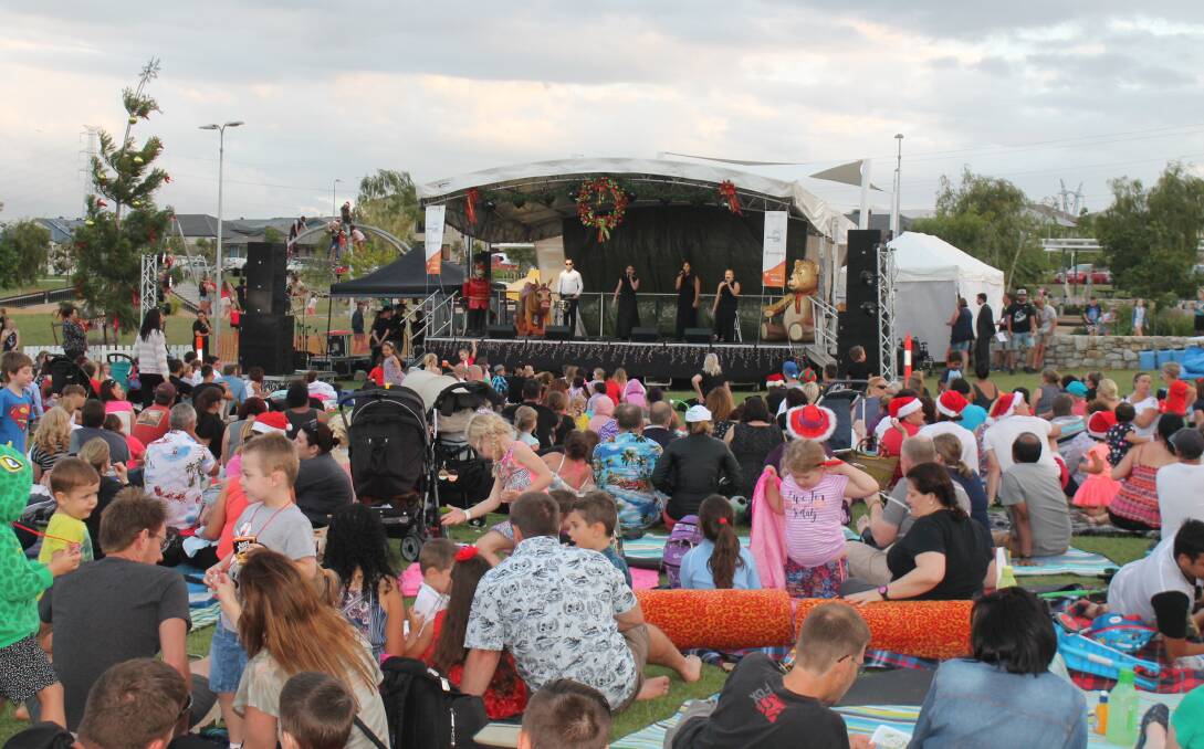JOIN AS ONE: More than 5500 people attended Carols in the Parkland last year. With a bigger number expected celebrations will now take place at Shaw Street Oval. 