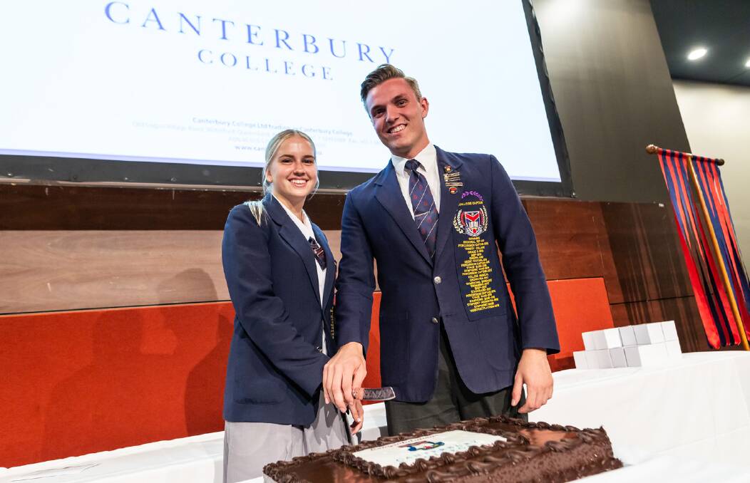 CELEBRATION: College Captains Emma Jordin and Saxon Harris cut the graduation cake on behalf of the advancing year 12 students. 