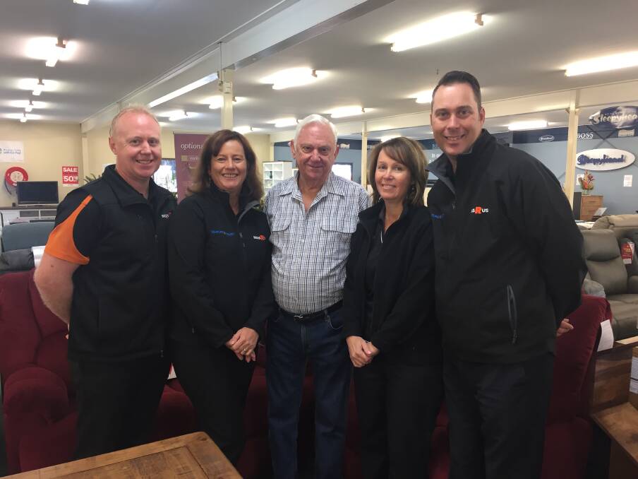 Great team: Furniture Court managing director David Holdorf pictured with wife Tina, dad Ray and Boonah staff members Tanya and Brad.