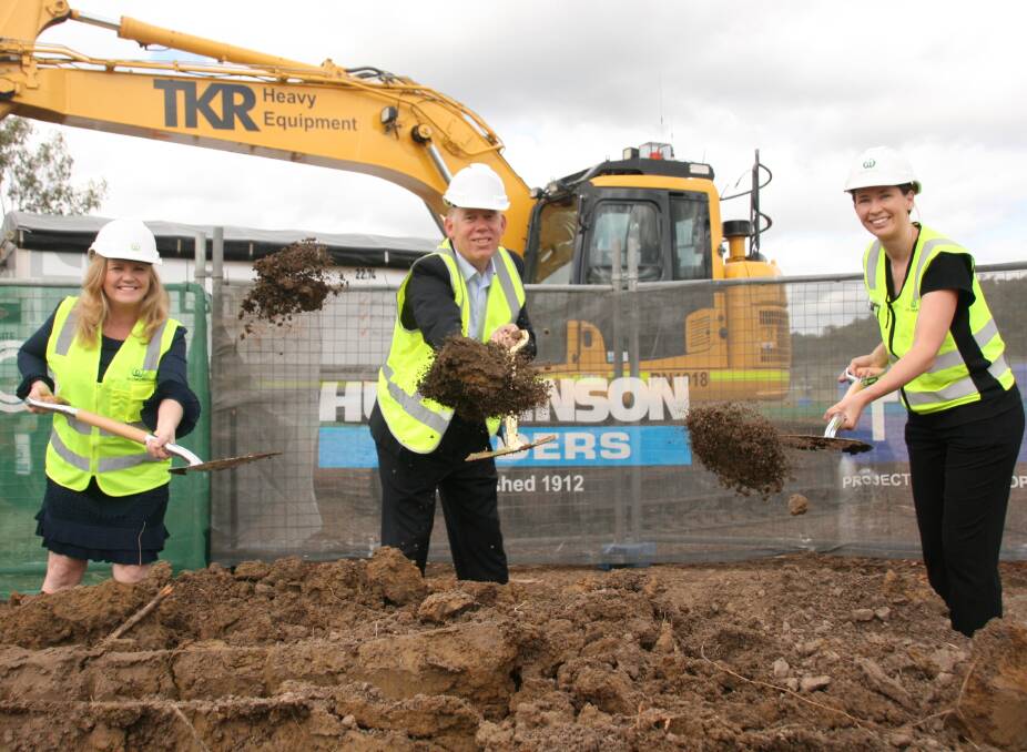 STORE ON THE WAY: Logan councillor Laurie Koranski, Forde MP Bert van Manen and Woolworths regional development manager Savanah Powell turn the sod at the site of the new supermarket at Bannockburn.