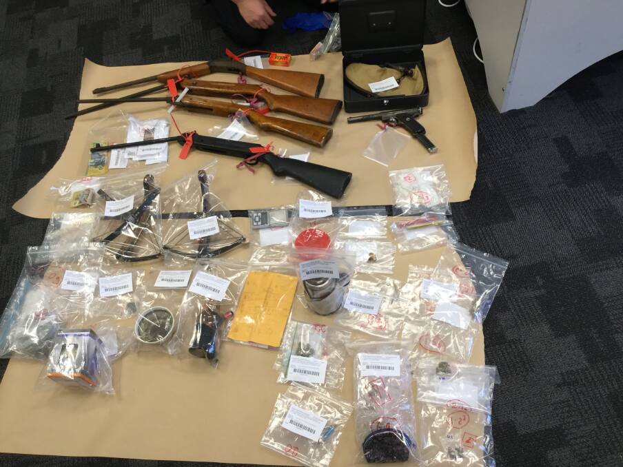 WEAPONS HAUL: Police found guns, crossbows and drugs at a Greenbank address on Monday.