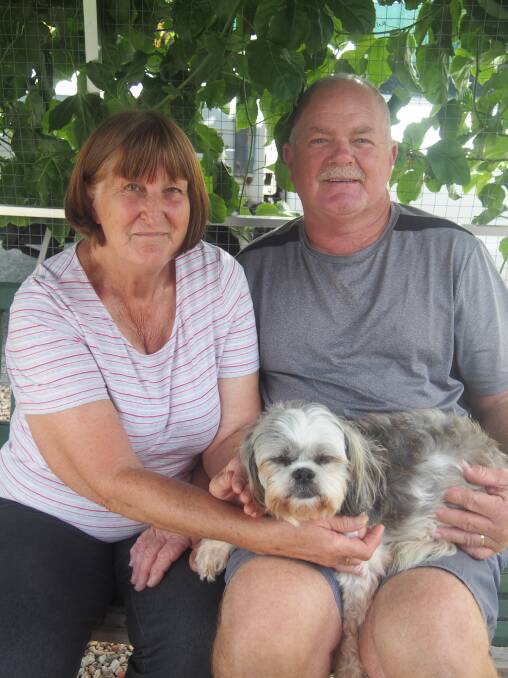 MORE THAN A PET: Neil and Susan Glasby with new furry friend Charleen.