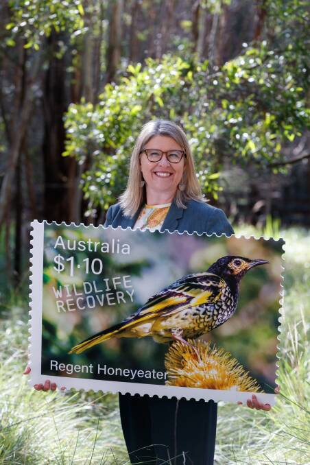 FIRE VICTIM: Sally Box with a stamp featuring the regent honeyeater.