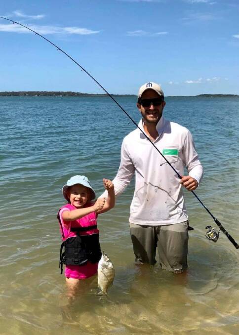 CHECK IT OUT DAD: Andrew Parker and daughter Evie, 6, with a nice bream caught on Coochiemudlo Island