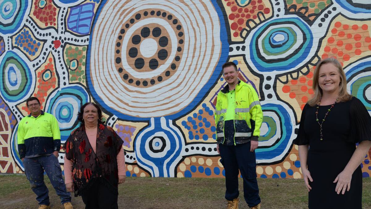 PENNY AND THE TEAM: Council's mural team artist Jay Christensen, community elder Aunty Peggy Tidyman, artist Paul Turnbull and Cr Laurie Koranski with the mural at the Logan Art Gallery.