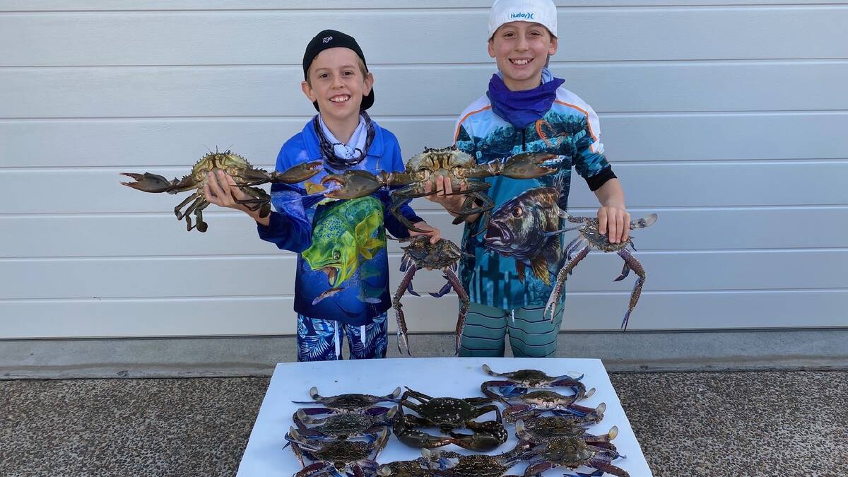 GREAT CATCHES: Redland Bay locals, Travis and Aleisha Rudkin and their two boys, Kai, 10, and Riley, 12, sent in a photo of a great catch of crabs. They used fresh mullet.