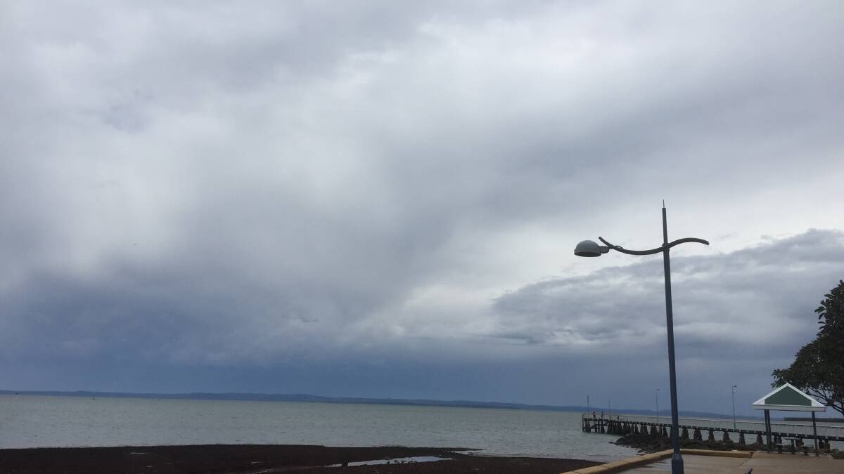 WHAT WE WANT TO SEE: Heavy clouds form at Wellington Point, Redlands, on Saturday.
