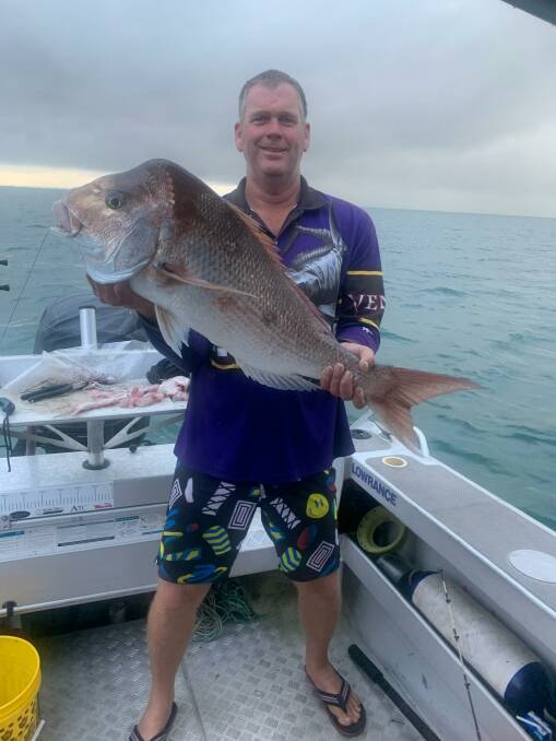 BIG NOBBY: Kirk Brinkman with a hefty snapper that he caught when expecting a mackerel.