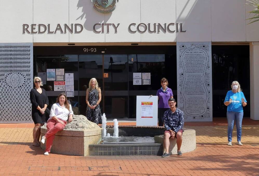 SAFETY FIRST: Candidates keep their distance outside the Redland City Council chambers as they launch the #noelectionsigns movement ahead of polling day tomorrow. 