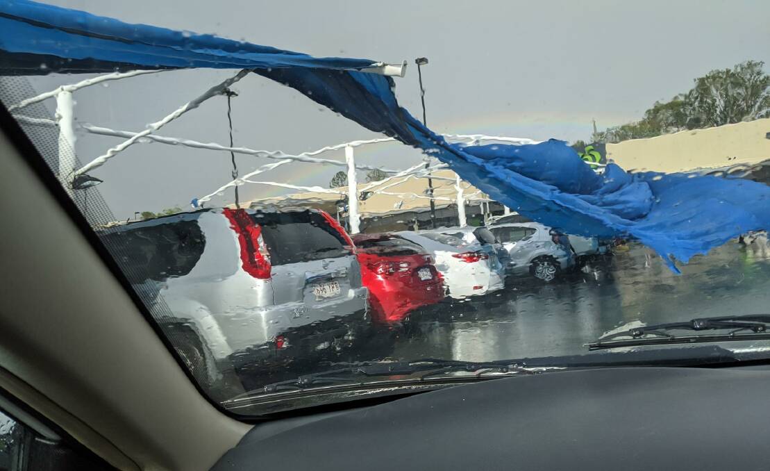 STORM: The shade cloth at Woolworths car park was torn away in heavy winds. Photos: Kyle Nicklas