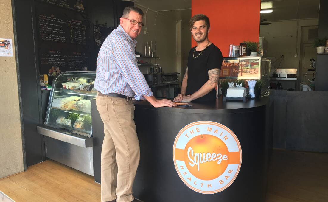 GO LOCAL: Federal Member for Wright Scott Buchholz with Luke Tier from The Main Squeeze Health Bar in Beaudesert, is encouraging locals to back small business and buy local this Christmas season. Photo: Supplied
